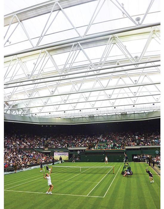 The 60,000-square-foot retractable roof on top of Wimbledon's new Centre Court, created by the design firm Populous, means the end of rain-outs. The accordion-like fabric roof, which unfolds by way of nine 250-foot, court-spanning trusses, covers the open ground in seven minutes. The fabric, called Tenara, is tough enough to flex thousands of times, and it's 40 percent translucent. The court remains dry, but natural light still gives matches that outdoor feel. See more at the Best of What's New 2010 site. <strong>Jump To:</strong>