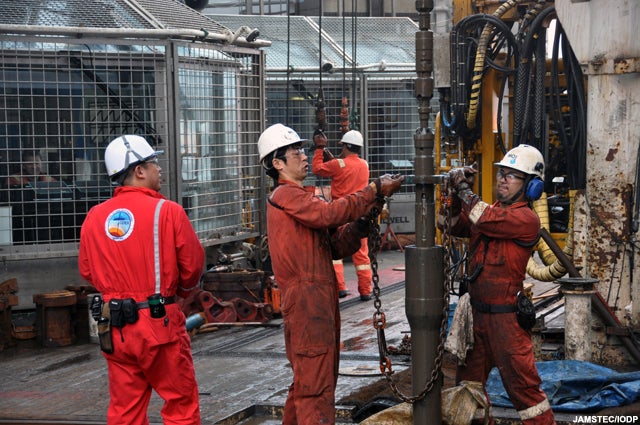 Crewmembers wrangle with the drill during operations last week.