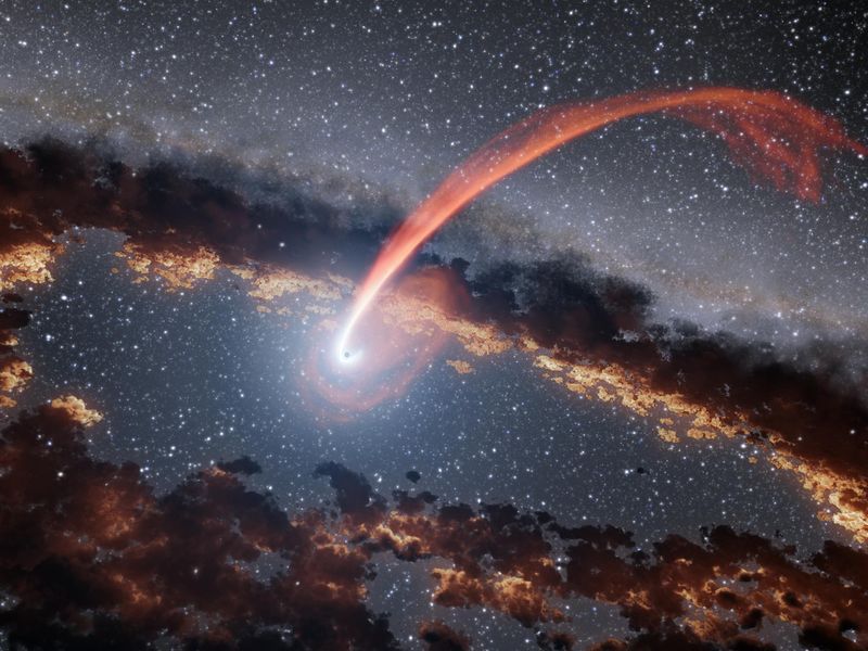 Illustration of a star being sucked into a black hole.