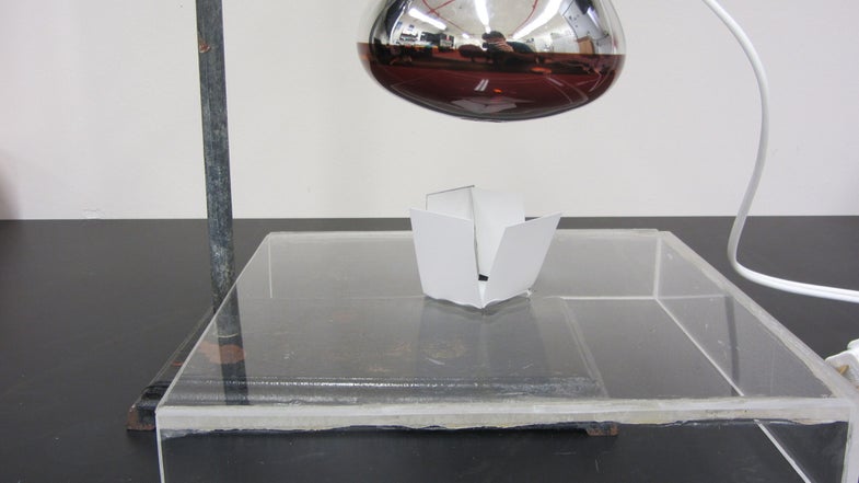 The researchers cut a polystyrene sheet into a box shape, which then folded into a box when put under an infrared lamp