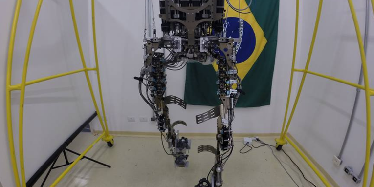 Human In Robotic Exoskeleton To Kick Off The World Cup
