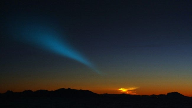A baffling nighttime light show over Norway consisted of a spiraling bluish circle, with a green-blue beam of light emanating from the center. Speculation on the Dec. 9th phenomenon ranged from a missile test to a meteor display.