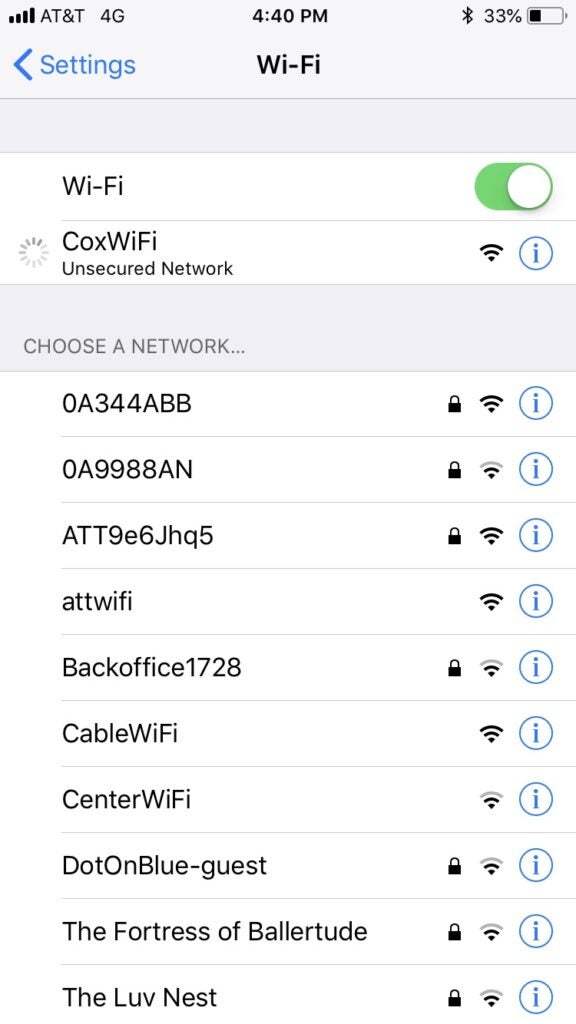 An iPhone WiFi settings menu showing a connection to a Cox WiFi hotspot.