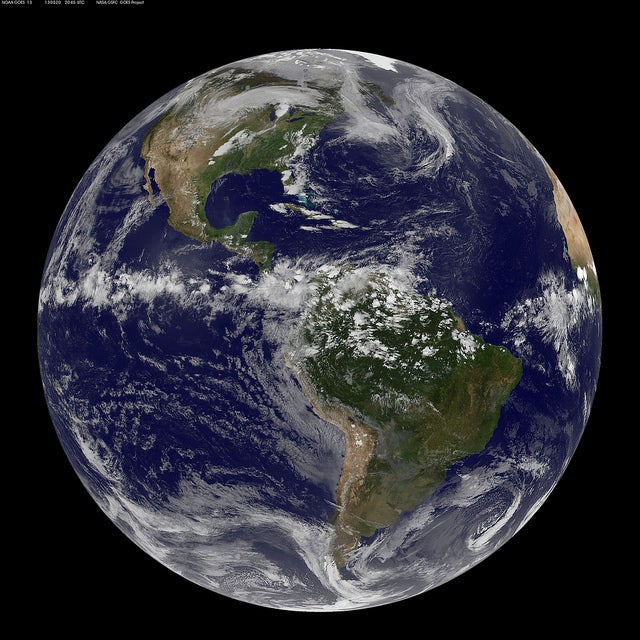 Here's a full-on "disk" shot of the planet, taken by NOAA's GOES-13 satellite. (Fun fact: NOAA is pronounced like the name "noah.") You can see the storm over the central part of the US.