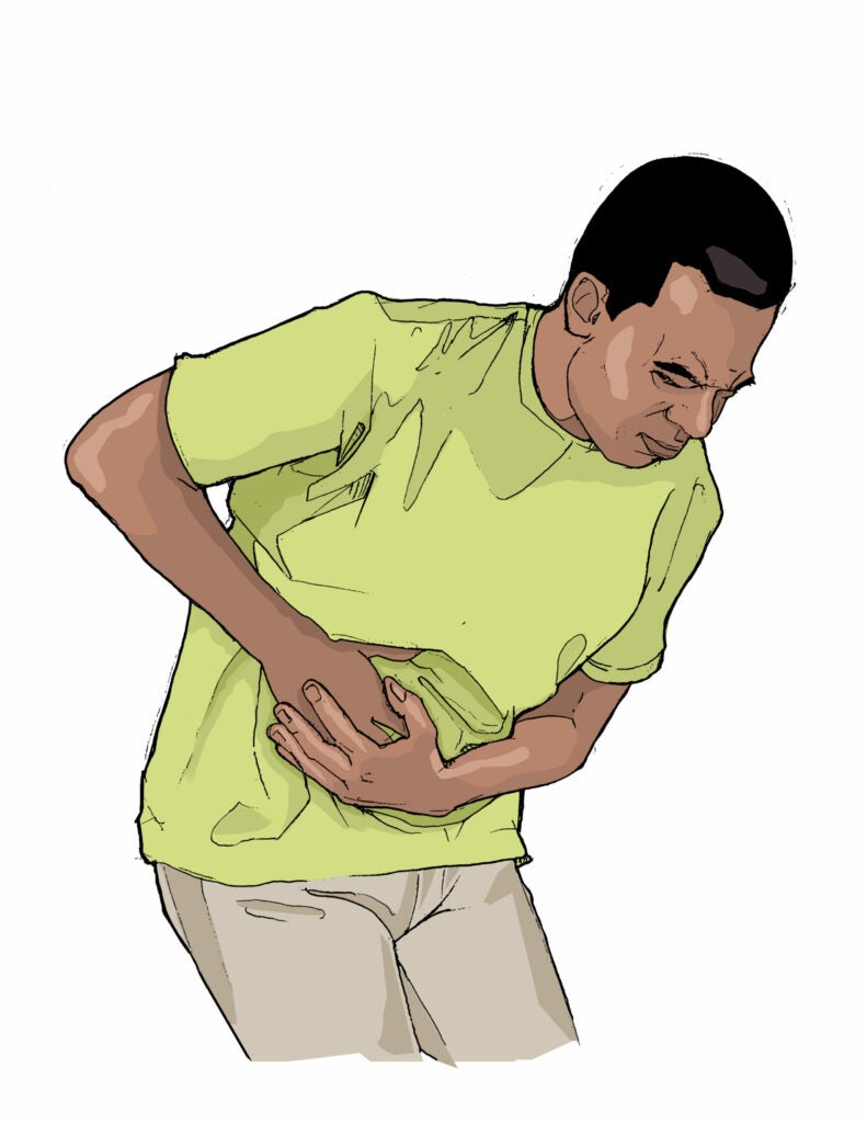 man experiencing stomach pain