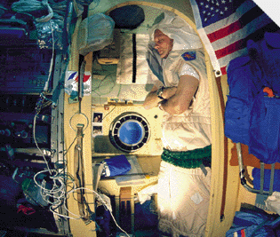 Astronaut sleeping on ship