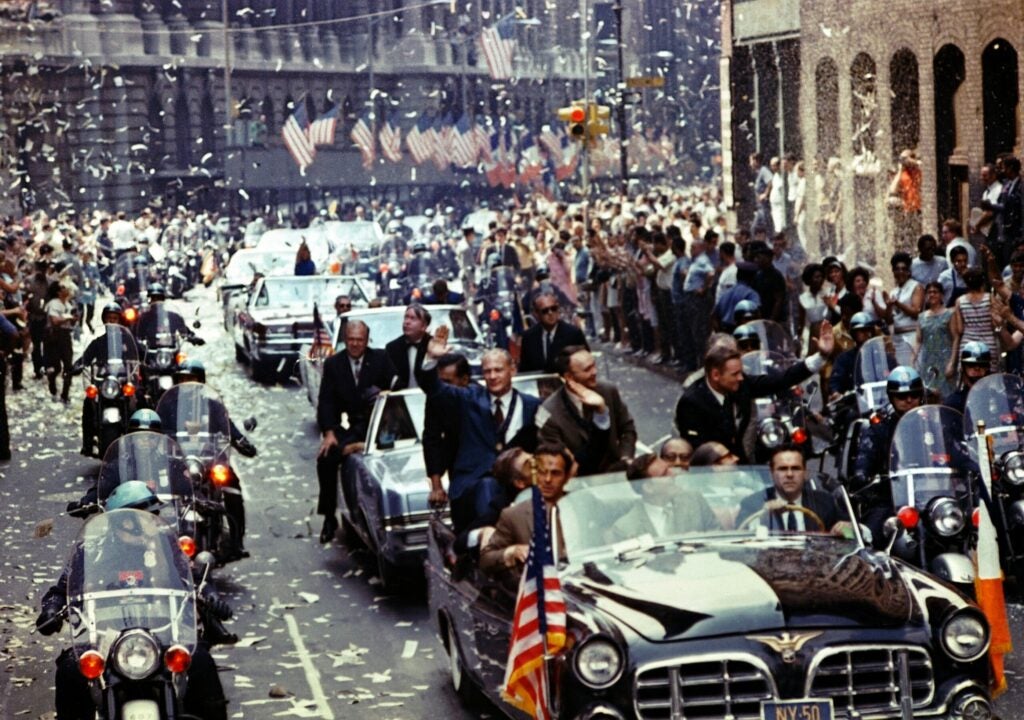 On August 13, Aldrin, Collins, and Armstrong waved from a car to people lining Broadway and Park Avenue in New York City. They'd been released from quarantine just ten days prior.