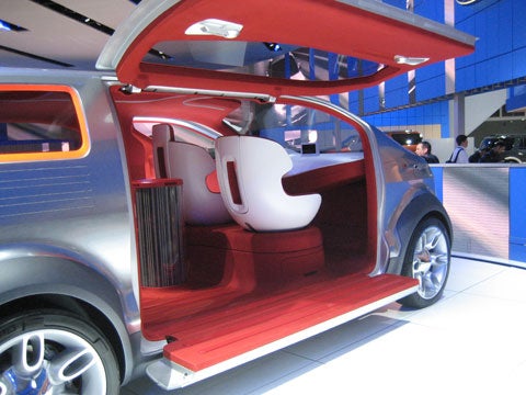 The Airstream has pod front seats that swivel to face the rear and a 360-degree television-like thingy in the middle that doubles as a mood lamp, â€because you need that,â€ joked Ford´s head designer, J Mays.