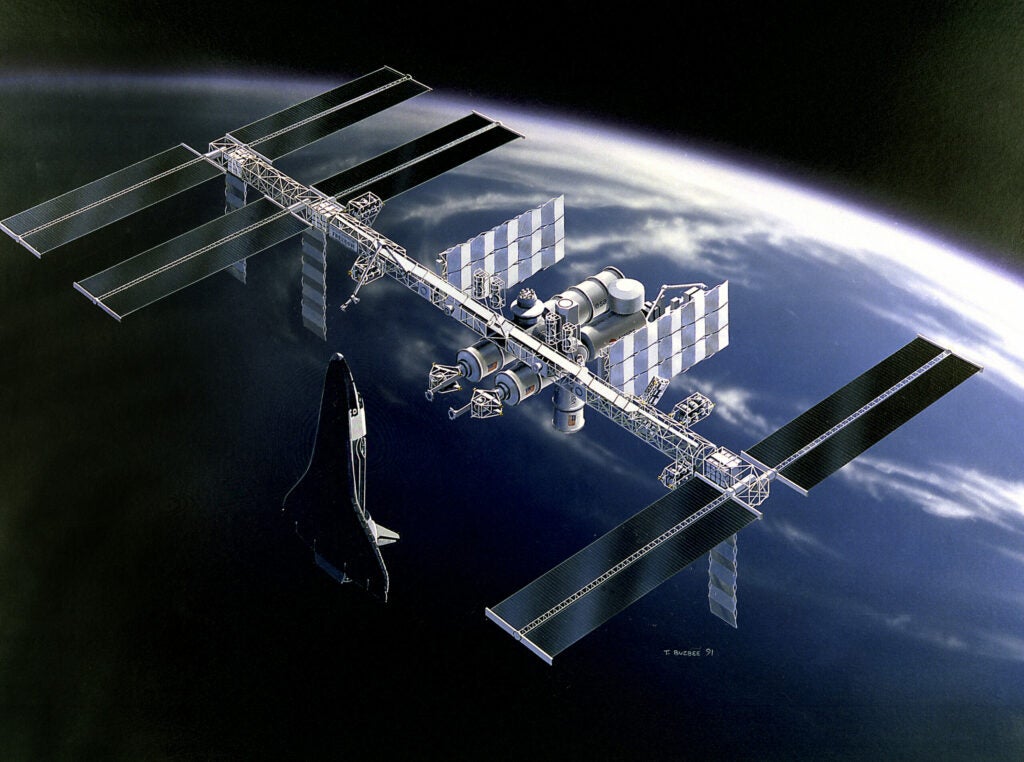 This 1991 concept art shows space station Freedom in orbit around the Earth. Freedom was the first true space station concept NASA tried to get off the ground. It was designed to be the launch point for missions to the Moon and Mars in addition to an orbital living and work space.