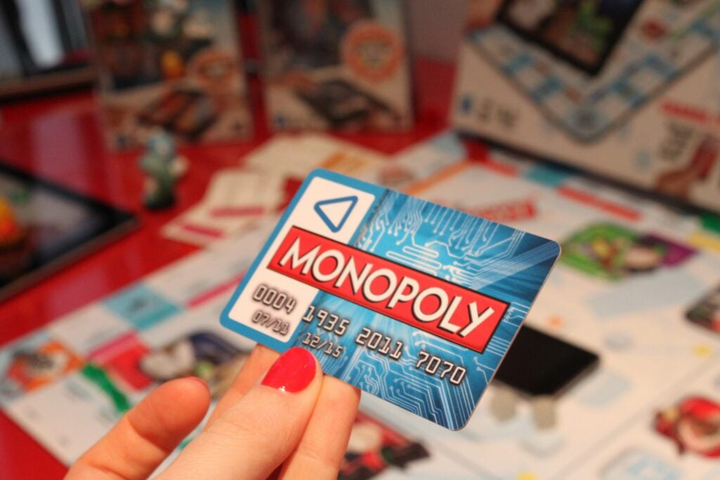 Cheating banker? Not this time. The newest Monopoly iteration uses all digital money. Each player has a faux credit card, and an app tracks their account balance. Make a purchase or pay someone else rent by tapping the back of your card on the iPhone screen. ** $25<br />
available June**