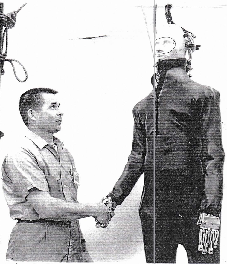 engineer shaking hands with a dummy