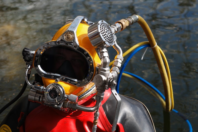MacCallum's dive helmet is the first that routes all exhaust air back to the boat rather than venting it into the water, completely sealing the diver from the chemicals outside.
