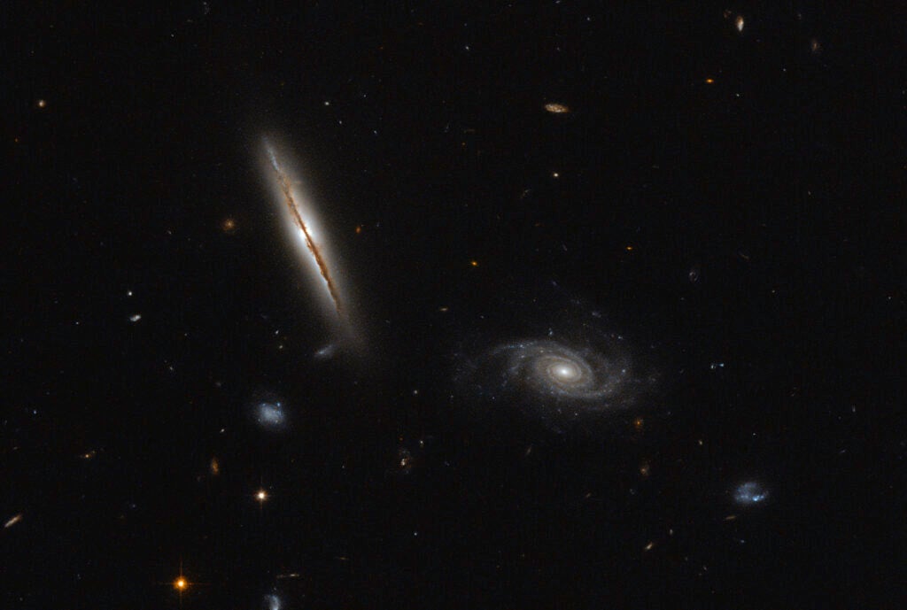 The spiral-shaped galaxy LO95 0313-192 is unusual for its jets of particles shooting from its center, which normally occur at the cores of elliptical galaxies or merging galaxies. The star system is roughly one billion light years away, according to <a href="https://www.nasa.gov/image-feature/goddard/2016/hubble-finds-misbehaving-spiral">NASA</a>