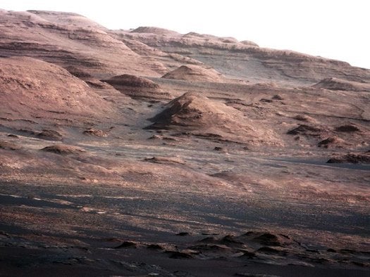 Curiosity has some amazing cameras, and already it has sent the best-detailed images of Mars humans have ever seen. This photo shows massive Mount Sharp, Curiosity's ultimate destination in the heart of Gale Crater. The mound at the center of the image is about 1,000 feet across and 300 feet high. If it was in the frame, Curiosity would look like a speck of dirt by comparison.