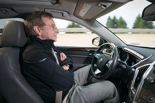 General Motors Staff Researcher Dr. Jeremy Salinger road tests a Cadillac semi-autonomous driving technology it calls"Super Cruise" that is capable of fully automatic steering, braking and lane-centering in highway driving under certain optimal conditions Friday, March 23, 2012 in Milford, Michigan. Super Cruise is designed to ease the driver’s workload on the freeway, in both bumper-to-bumper traffic and on long road trips by relying on a fusion of radar, ultrasonic sensors, cameras and GPS map data. The system could be ready for production vehicles by mid-decade. (Photo by John F. Martin for Cadillac)