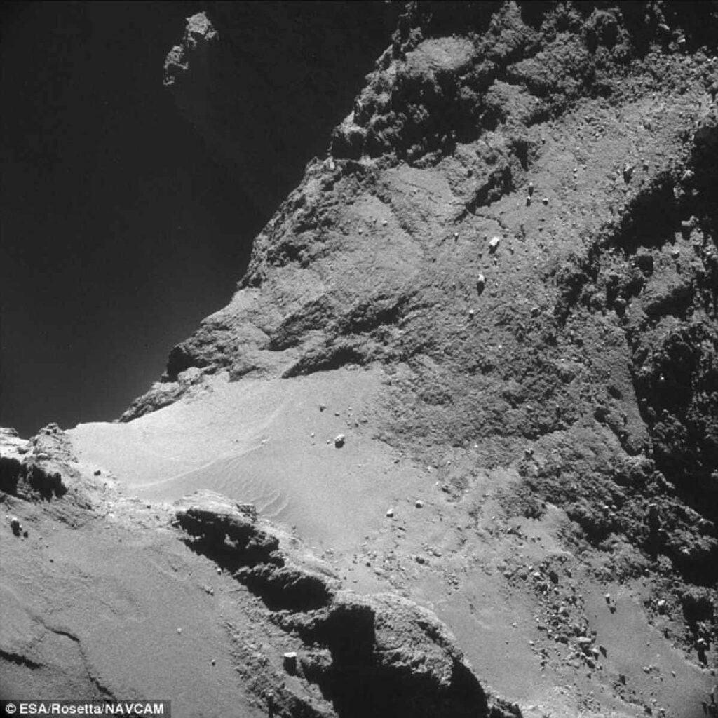 Examine the surface detail of a comet as never seen before. The Rosetta spacecraft, <a href="https://www.popsci.com/article/technology/esa-confirms-rosettas-landing-site-rubber-ducky-comet/">scheduled to make contact</a> with comet 67P/Churyumov-Gerasimenko on November 12, took this remarkable photo of the "rubber ducky" comet. The image shows the extraterrestrial landscape in high contrast, with sand dunes drifting across the middle. It looks beautiful, but the comet apparently smells awful, like "<a href="http://www.npr.org/blogs/thetwo-way/2014/10/24/358364942/european-scientists-conclude-that-distant-comet-smells-terrible/">sharing a horse barn with a drunk and a dozen rotten eggs</a>." <a href="https://www.popsci.com/article/science/virtual-hearts-fanged-deer-and-other-amazing-images-week/"><em>From October 31, 2014</em></a>