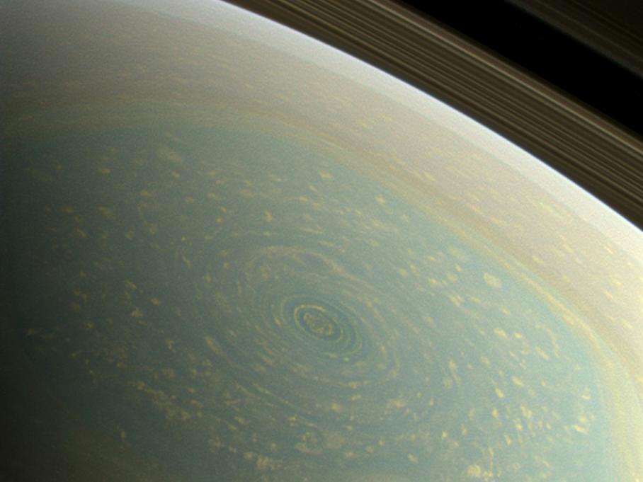 Cassini captured this true color image of an apparently permanent hurricane on the surface of Saturn. <a href="https://www.popsci.com/science/article/2013-04/bigpic-stormy-saturn-incredible-technicolor/">Learn more about the hurricane</a>.