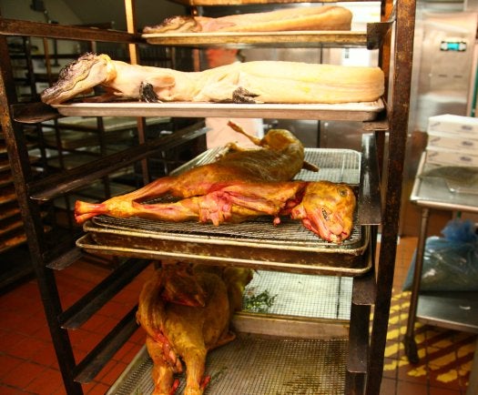 Here in the subterranean kitchen of the Waldorf-Astoria, hours before the feast, the goats have already been rubbed with Moroccan spices. The alligators will be roasted whole.