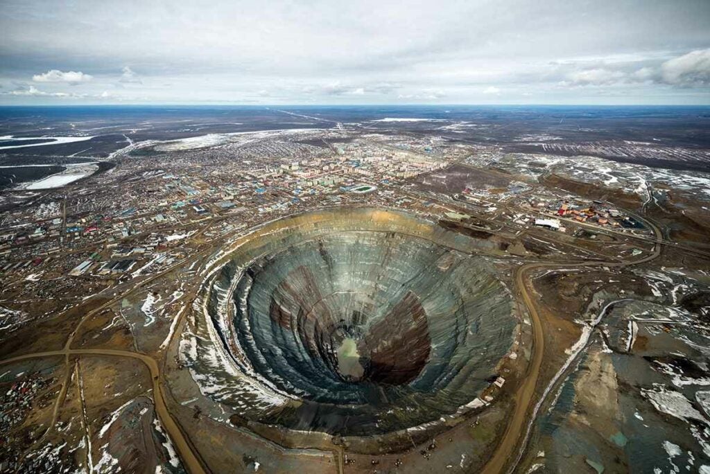 This humongous crater is actually a retired diamond mine in Siberia. The 525-meter-deep and 1.2-kilometer-wide pit is the second-largest excavated hole in the world. <a href="https://www.popsci.com/article/science/legion-walruses-hidden-moon-valleys-and-other-amazing-images-week/"><em>From October 3, 2014</em></a>