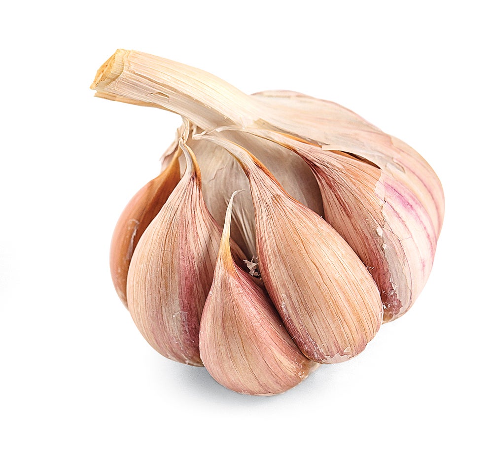A bulb of garlic, divided into cloves