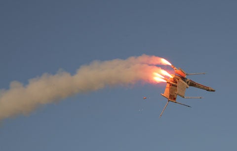 A homemade Star Wars X-wing rocket exploding at Plaster Wars 2007.