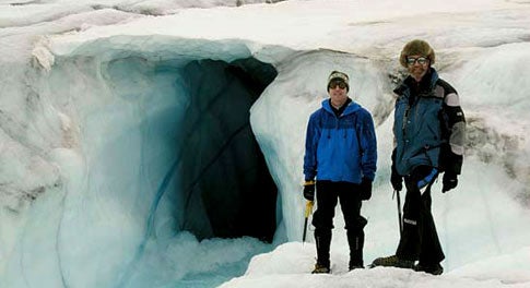 MOULIN BLEU Steffen [right] prepares to explore a moulin, a fissure that drains meltwater to the bedrock.