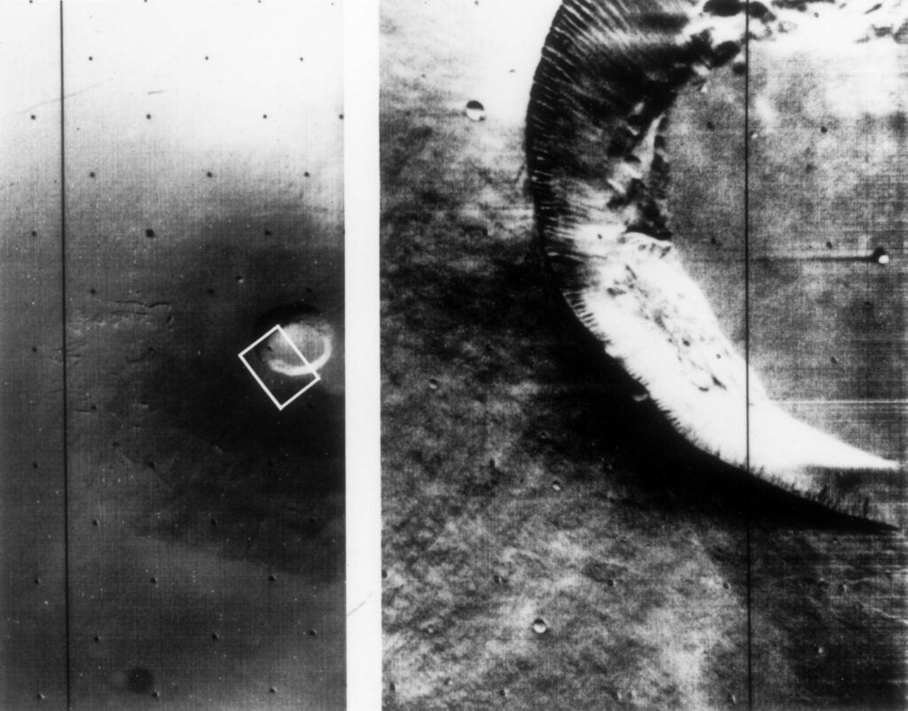 A close-up view Martian shield volcano about 25 miles across at the rim of a crater as seen from Mariner 9.
