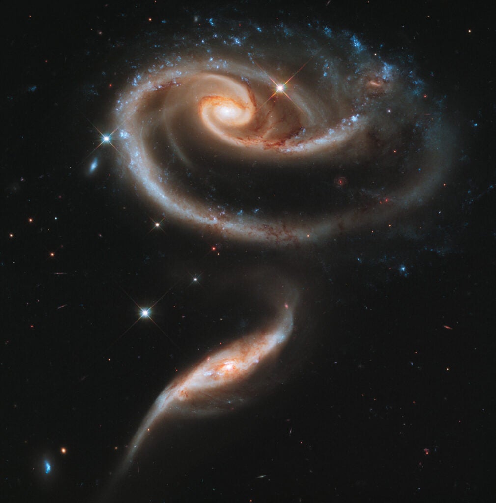 Two galaxies collide and happen to resemble a rose