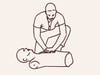 man performs CPR on a dummy