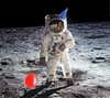 astronaut on the moon with a red balloon