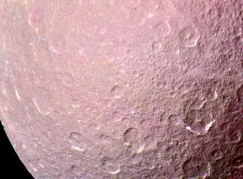 This image of Saturn's moon Rhea was taken just before Voyager 1's closest approach to the moon in 1980. The visible area is heavily cratered and indicates an ancient surface that dates back to the time immediately after the formation of the planets.
