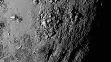Pluto's surface is covered by young, icy mountains