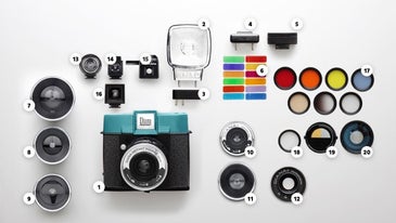 A Polaroid-style camera with interchangeable lenses and a hotshoe flash? Yes please.