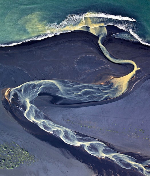 To create this lovely photo of rivers running through Iceland's volcanic ash, photographer Andre Ermolaev took to the skies. See more from this series at at <a href="http://500px.com/andreabe">500 px</a>.