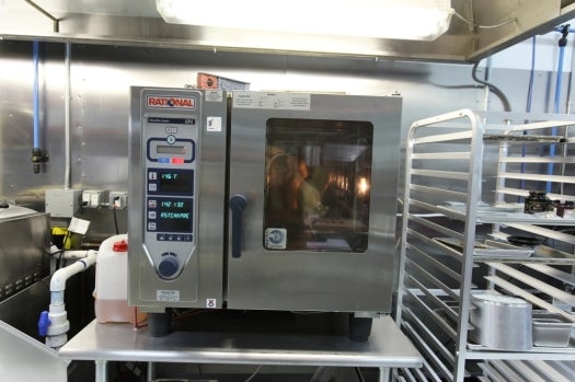 The Rational oven maintains a precise temperature and humidity, or even steps through a programmed sequence. This one is set to the RSTCHK roast chicken program.