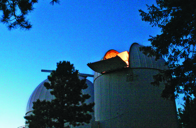 When night falls, Arizona's Catalina Sky Survey telescope scans the heavens hourly for asteroids. It takes a snapshot of the night sky and then rotates to image another patch, eventually covering a huge swath. Inset: October 7, 2008—a cellphone snapshot of smoke billowing above the Nubian Desert after asteroid 2008 TC3 exploded in the atmosphere.
