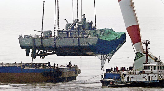 A 2,200-ton-capacity crane hoists the stern of a South Korean warship from the seafloor.