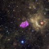 In here, Chandra's data, shown in purple, show the heated remains of an exploded star. Researchers think they took on this cube-like shape when they encountered surrounding cool gas. Around the supernova remnant, you can see other objects in this patch of sky as imaged with infrared (yellow) and optical (red, green and blue) data.