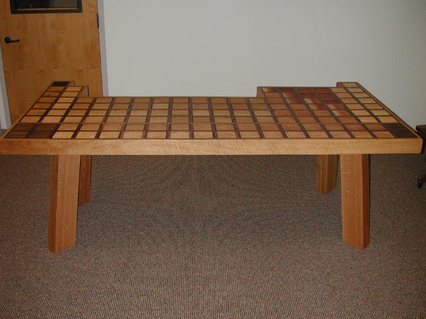 A wooden coffee table in a room.