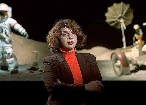 <em>Constance Adams stands before the Lunar Landscape section of Johnson Space Center's Starship Gallery. "I am one of the people who live in the boundary world between the space 'insiders' and the general educated public," she says.</em>