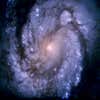 A blue-and-white, crystal-clear spiral galaxy viewed by Hubble in 1994.