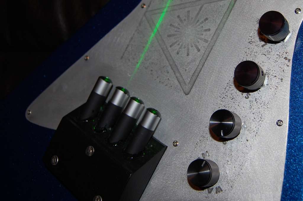 The laser strings of a homemade electric guitar.
