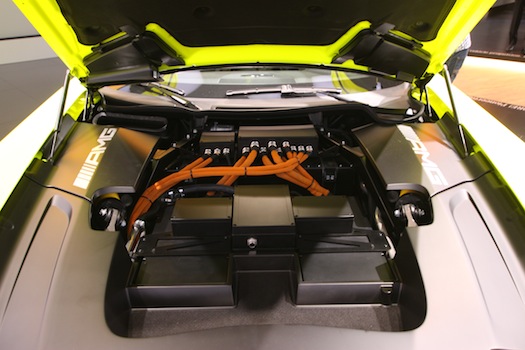 The black box under the hood houses the car's power electronics, while the batteries sit where the driveshaft would normally go.