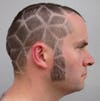 There's more to Nick Sayers' rhombus-based haircut than meets the eye. To quote <a href="http://blog.makezine.com/archive/2011/09/math-monday-make-a-mathematical-haircut.html">MAKE</a>: <em>The obtuse angles of each rhombus meet in groups of three, but the acute angles meet in groups of five, six, or seven, depending on the curvature. In the flatter areas, they meet in groups of six, like equilateral triangles, and in the areas of strong positive curvature they meet in groups of five, but in the negatively curved saddle at the back of the neck, there is a group of seven.</em>