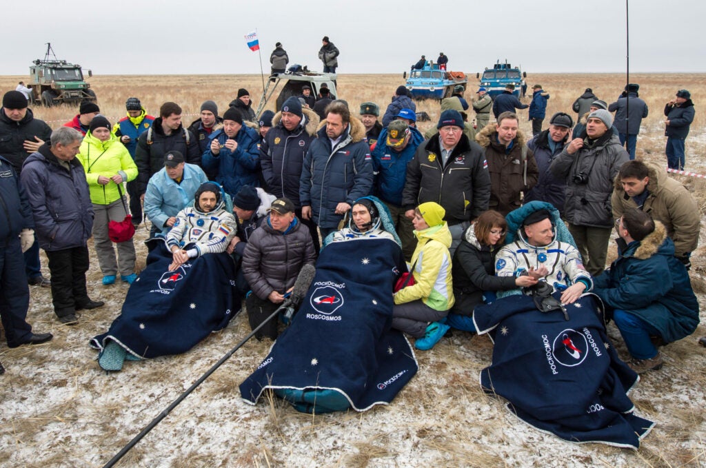 Crew of the Soyuz on the ground with their team
