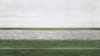 If you're wondering why this picture, taken by Andreas Gursky of a secluded stretch of the Rhine River, <a href="http://www.popphoto.com/news/2011/11/andreas-gursky-photo-rhein-ii-sells-43-million-auction">fetched more than four million dollars</a> at auction this week, well, join the club.