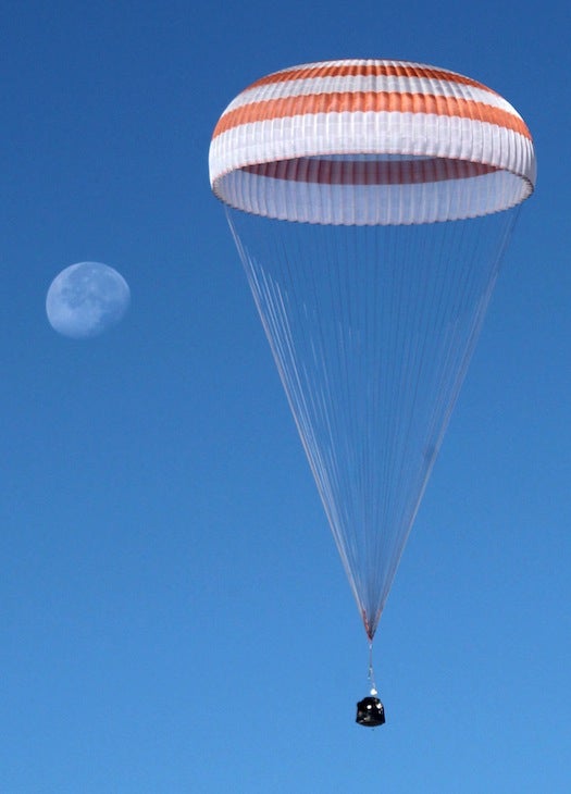 The Soyuz TMA-21 capsule, here seen in mid-air, landed about 93 miles from Dzhezkazgan, Kazakhstan, a small city smack-dab in the center of the country.