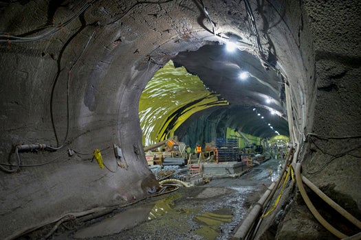 At the future 72nd Street station, workers are lining the raw rock of the cavern with concrete.