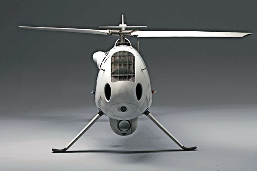 <strong>Class:</strong> Hovercraft<br />
<strong>Habitat:</strong> Warships, borders, forest fires, mob scenes<br />
<strong>Behavior:</strong> Made by Austrian electronics manufacturer Schiebel, the helicopter can take off and land autonomously from a half-sized helipad and fly for six hours with a 75-pound payload at 120 knots. Fitted with its standard infrared and daytime cameras, it can hover at up to 18,000 feet and watch anything from troop movements to illegal border crossings to spreading forest fires.<br />
<strong>Notable Feature:</strong> Separate controls for the vehicle and the cameras or payload allow for complex missions, such as deploying tear gas over a crowd.