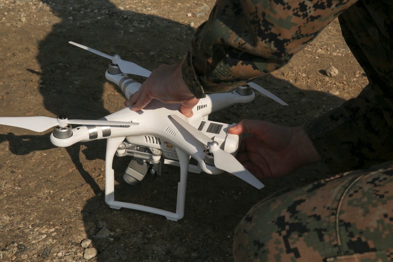 A Marine replaces a battery in the DJI Phantom 3 drone during a training exercise geared towards the development and strengthening of small unit-decision making at Camp Lejeune, N.C., Nov. 16, 2016. The Phantom 3 drone includes flight-planning and photogrammetry software which makes terrain models of an area for the battalion’s future training or field operations. The Marines that tested the new equipment are with 2nd Battalion, 6th Marine Regiment, 2nd Marine Division. (U.S. Marine Corps photo by Sgt. Kaitlyn V. Klein)